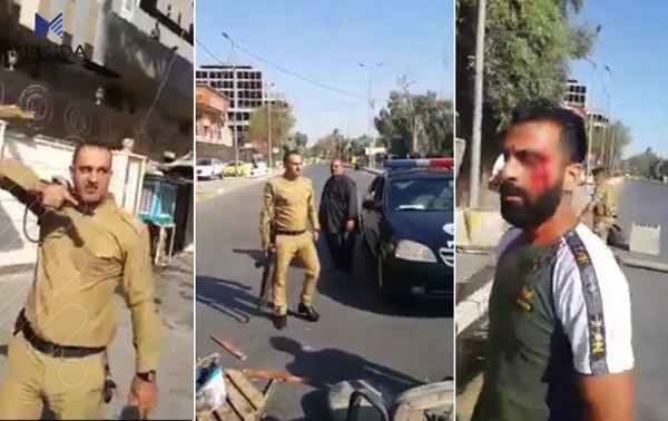 خۆپیشاندەران لە بەغدا پەلاماری ئەفسەرێكی كورد دەدەن